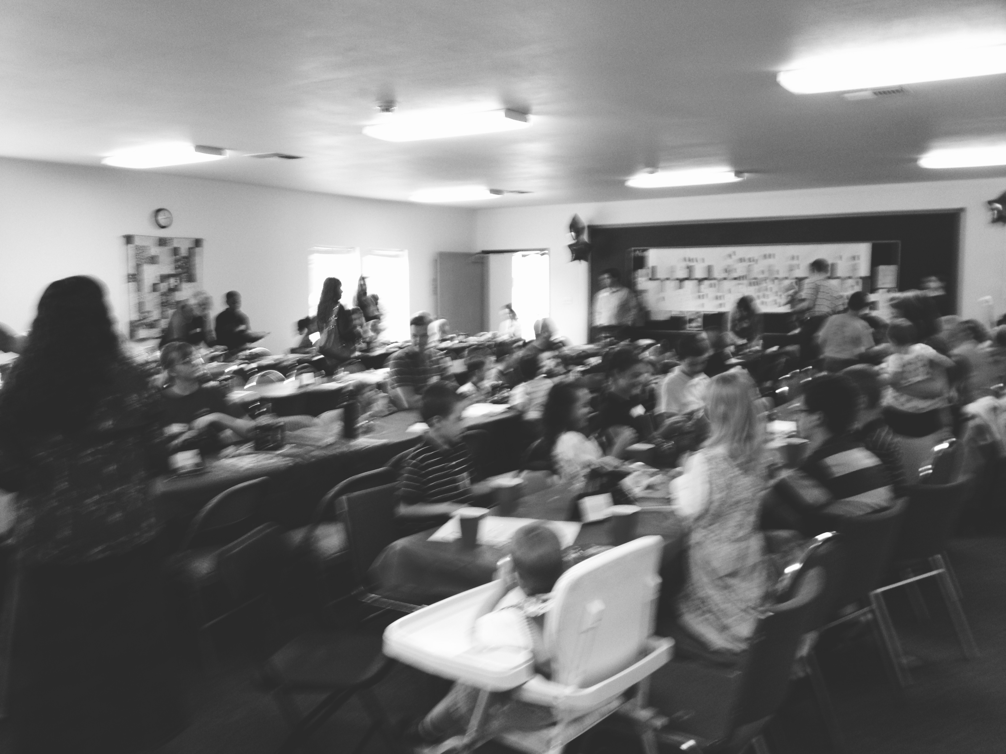 Members of Valley Baptist Church gather around tables sharing a fellowship meal after the Sunday service in McMinnville, Oregon